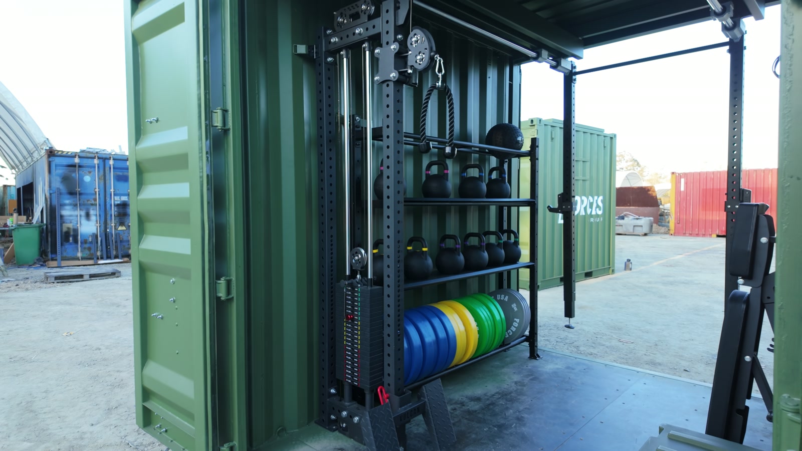 Genuine footage frame of the open Rapid-10 showing its rig, kettlebells and weight storage in the demonstration yard