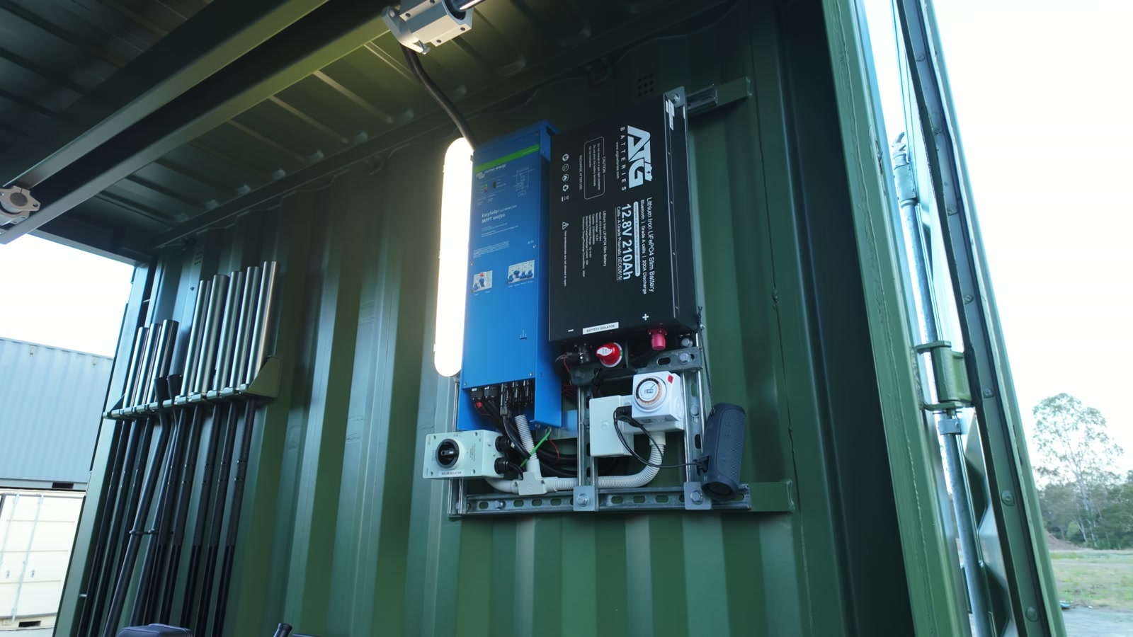 Genuine footage frame showing the battery and inverter equipment mounted inside the Rapid-10 at the demonstration yard